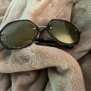 Fun shaped, floating lens Henri Bendel vintage sunglasses